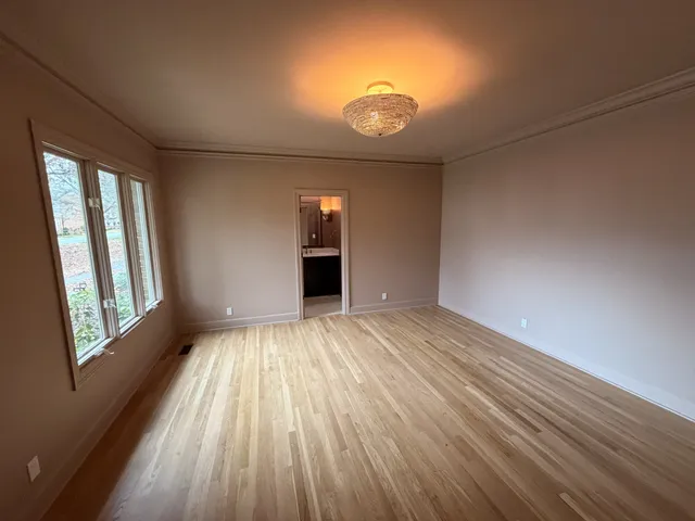 a view of a kitchen cabinets and a wooden floor
