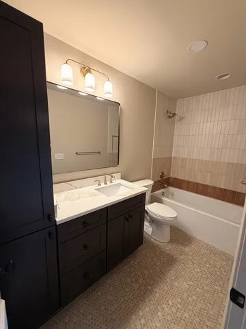 a kitchen with stainless steel appliances granite countertop a sink stove and wooden floor
