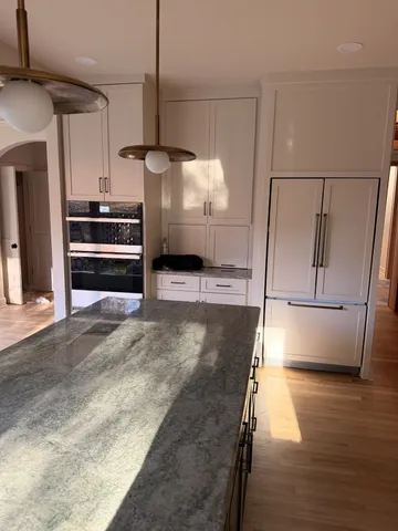 a bathroom with a sink and mirror