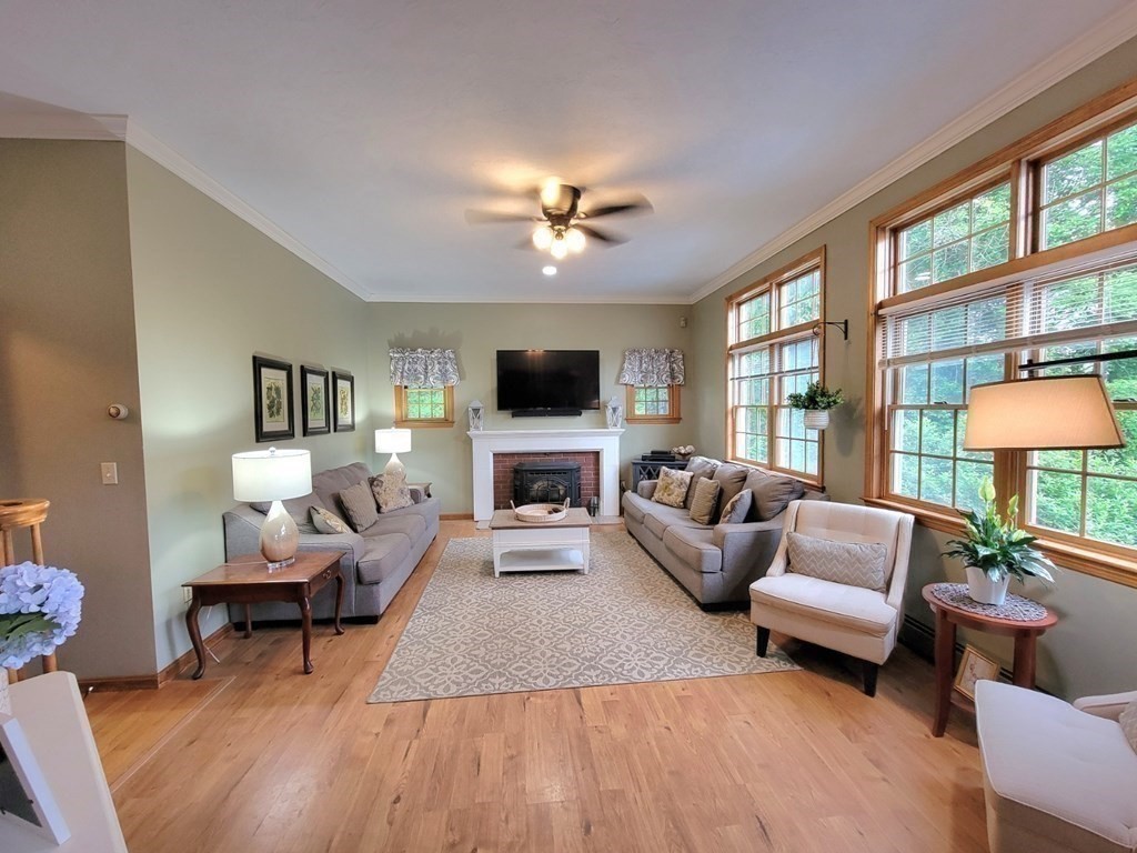 43 Mendon Road Sutton, MA 01590 - Photo 13 of 37 a living room with furniture and a flat screen tv