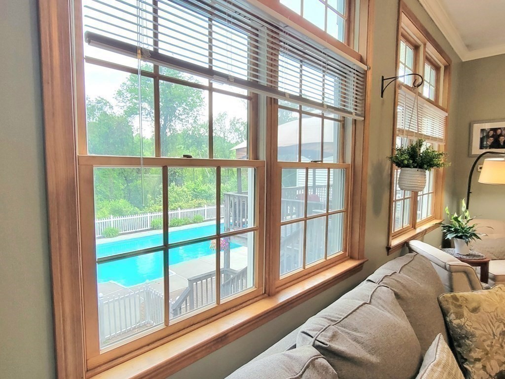43 Mendon Road Sutton, MA 01590 - Photo 14 of 37 a living room with furniture and a large window