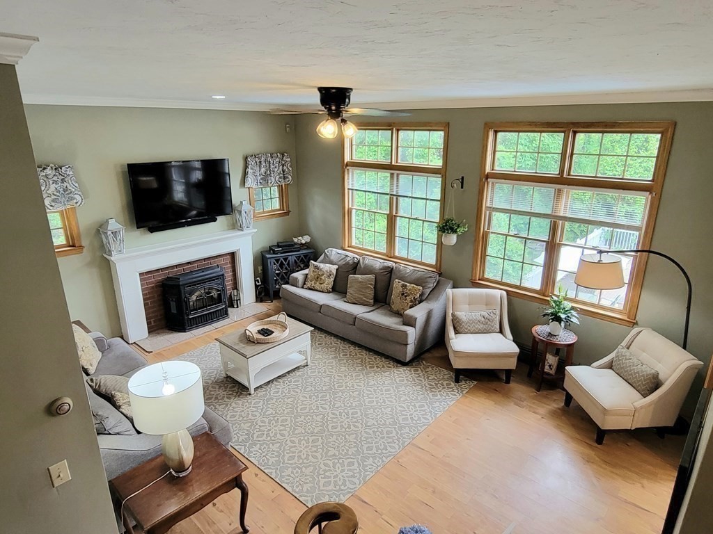 43 Mendon Road Sutton, MA 01590 - Photo 16 of 37 a living room with furniture window and a flat screen tv