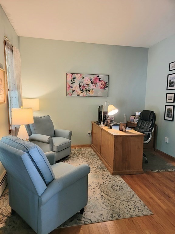 43 Mendon Road Sutton, MA 01590 - Photo 18 of 37 a living room with furniture and a window