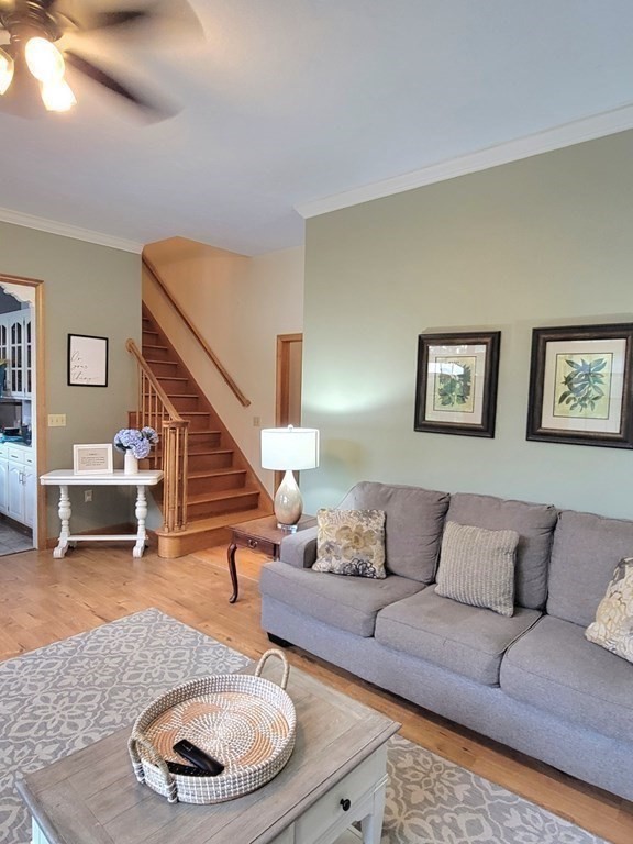 43 Mendon Road Sutton, MA 01590 - Photo 19 of 37 a living room with furniture and a wooden floor