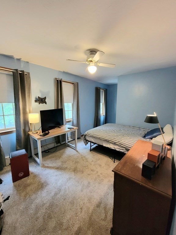 43 Mendon Road Sutton, MA 01590 - Photo 23 of 37 a bedroom with furniture and a flat screen tv