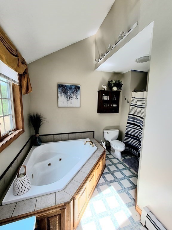 43 Mendon Road Sutton, MA 01590 - Photo 26 of 37 a bathroom with a bathtub and a toilet