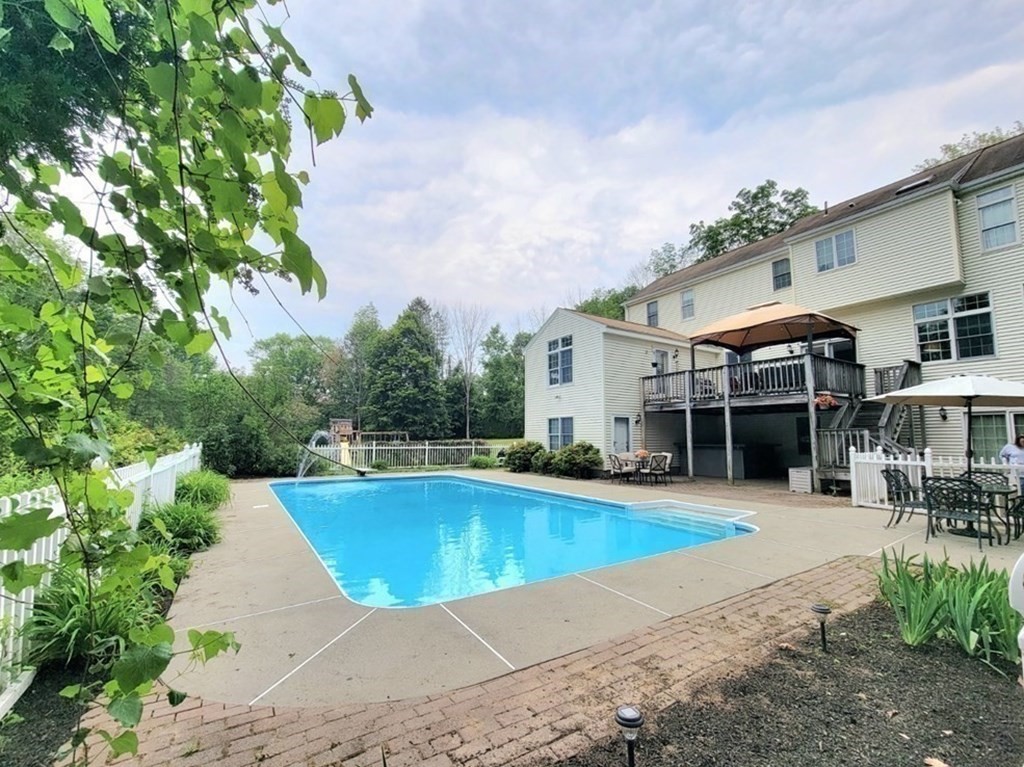 43 Mendon Road Sutton, MA 01590 - Photo 35 of 37 a view of a house with swimming pool and sitting area