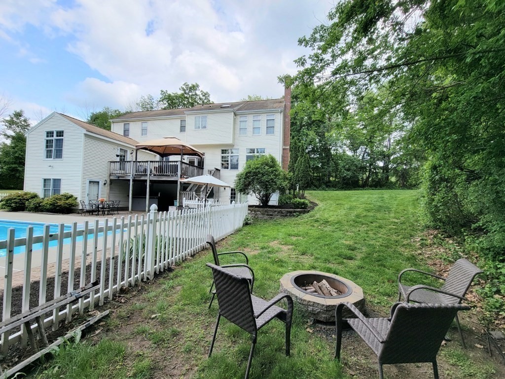43 Mendon Road Sutton, MA 01590 - Photo 5 of 37 a view of a house with backyard and sitting area