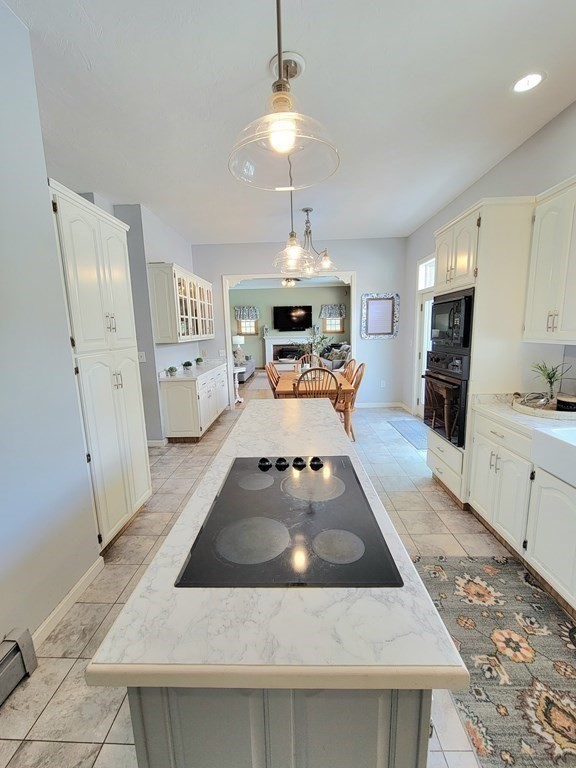 43 Mendon Road Sutton, MA 01590 - Photo 7 of 37 a kitchen with a stove a refrigerator and a sink