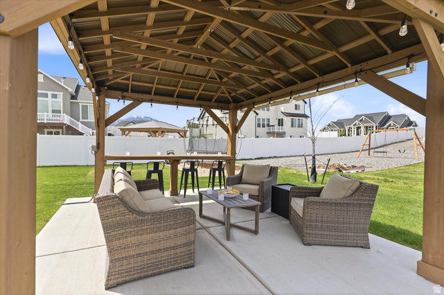 283 North 500 West Mapleton, UT 84664 - Photo 81 of 102 Fenced backyard featuring a gazebo, a patio, a residential view, an outdoor lounge area, and a playground.