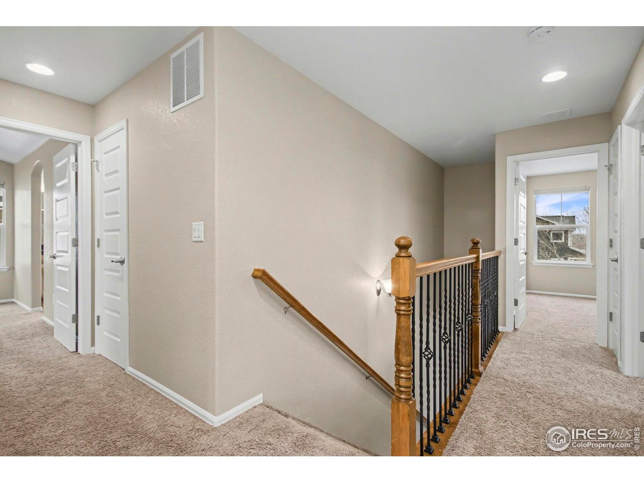5894 Graphite Street Timnath, CO 80547 - Photo 24 of 50 a view of a hallway view with three rooms