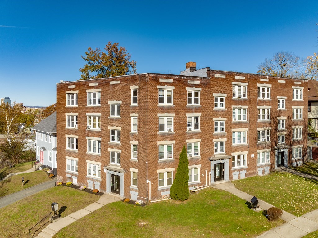 a view of a building with a yard