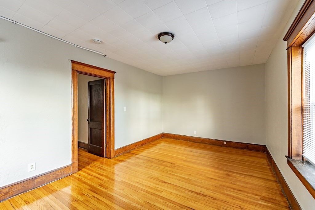 41-49 Belmont Avenue Springfield, MA 01108 - Photo 12 of 18 a view of empty room with wooden floor and fan