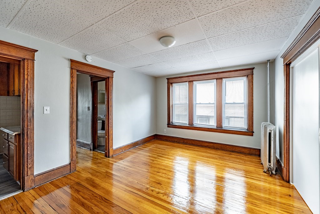 41-49 Belmont Avenue Springfield, MA 01108 - Photo 15 of 18 a view of an empty room with glass door and wooden floor
