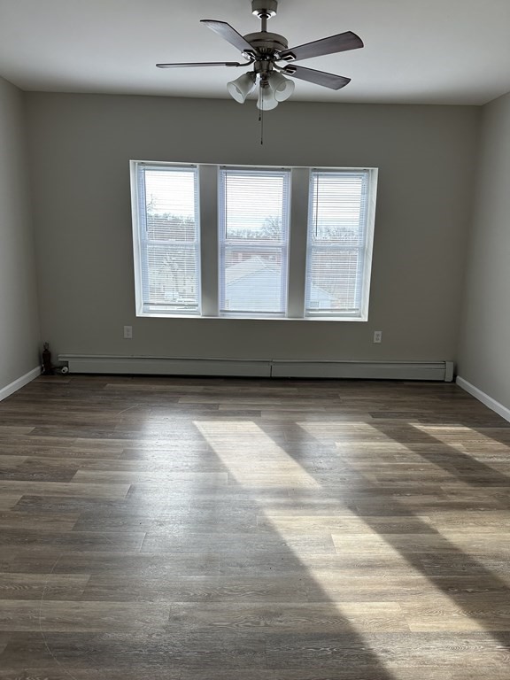 41-49 Belmont Avenue Springfield, MA 01108 - Photo 18 of 18 an empty room with wooden floor and windows