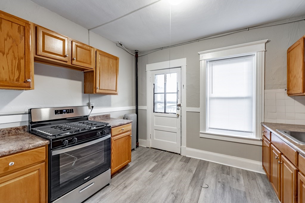 41-49 Belmont Avenue Springfield, MA 01108 - Photo 6 of 18 a kitchen with stainless steel appliances granite countertop a stove and a sink