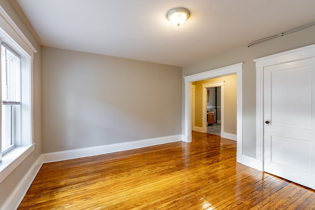 41-49 Belmont Avenue Springfield, MA 01108 - Photo 10 of 18 an empty room with wooden floor and windows