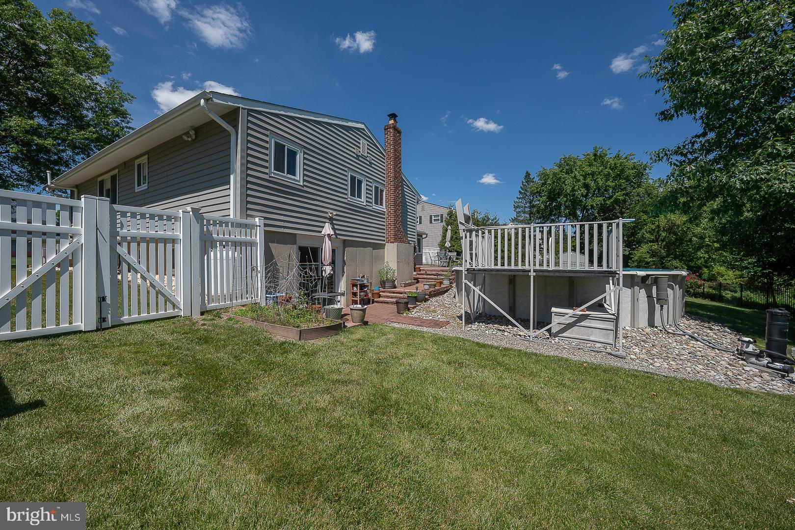 848 Mourning Dove Road Audubon, PA 19403 - Photo 68 of 86 a view of a house with a patio and a yard