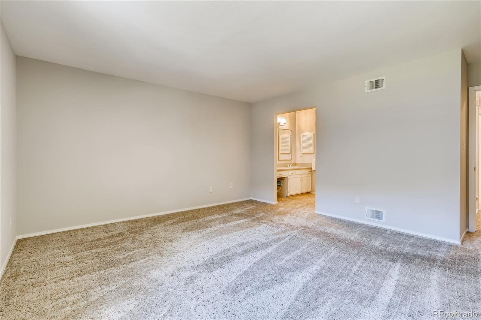 8022 West 78th Way Arvada, CO 80005 - Photo 16 of 30 a view of an empty room and window