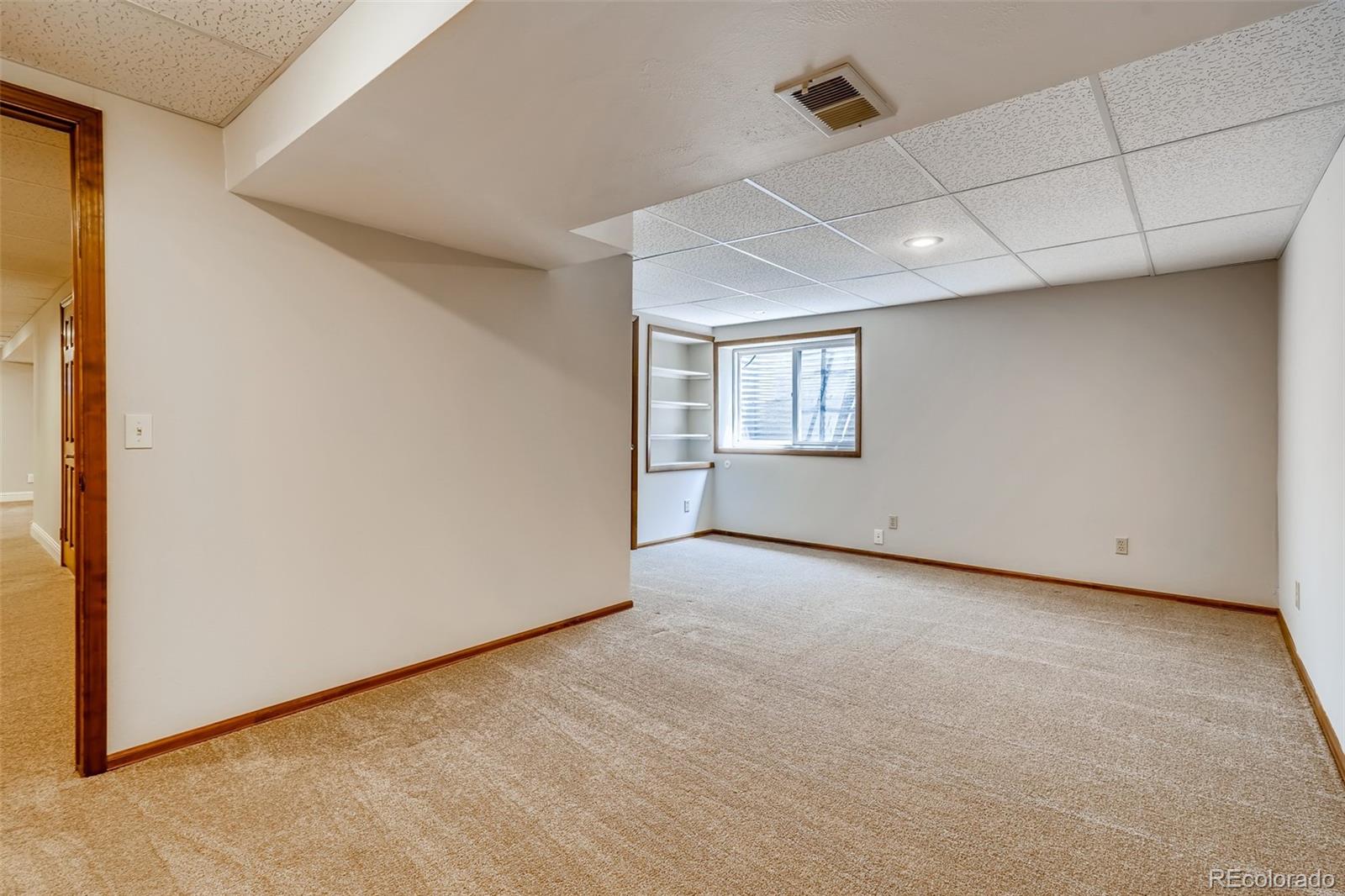 8022 West 78th Way Arvada, CO 80005 - Photo 23 of 30 an empty room with windows