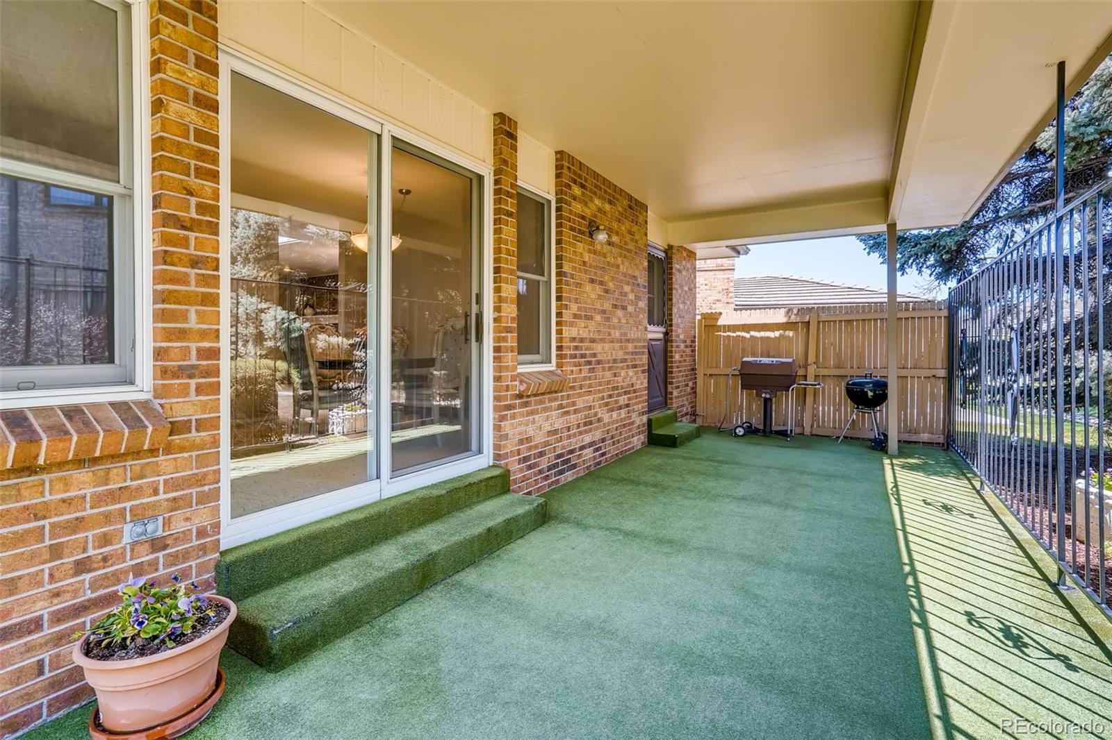 8022 West 78th Way Arvada, CO 80005 - Photo 27 of 30 a house view with a garden space