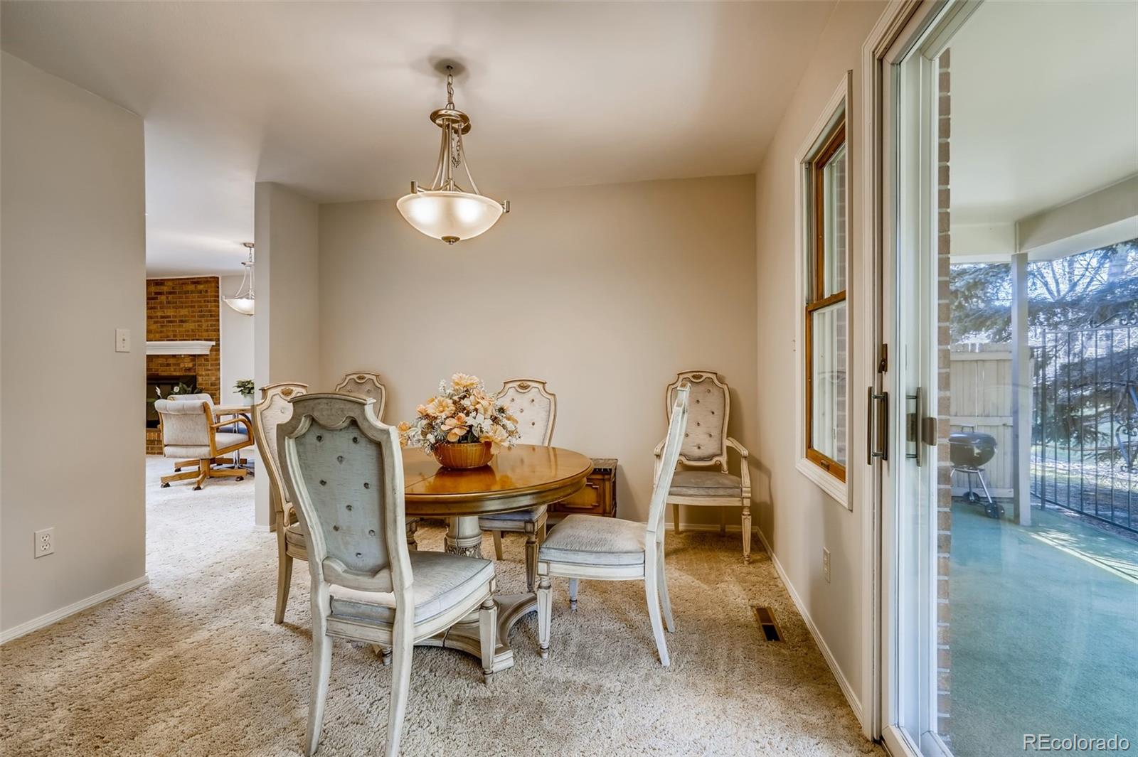 8022 West 78th Way Arvada, CO 80005 - Photo 8 of 30 a dining room with furniture and window