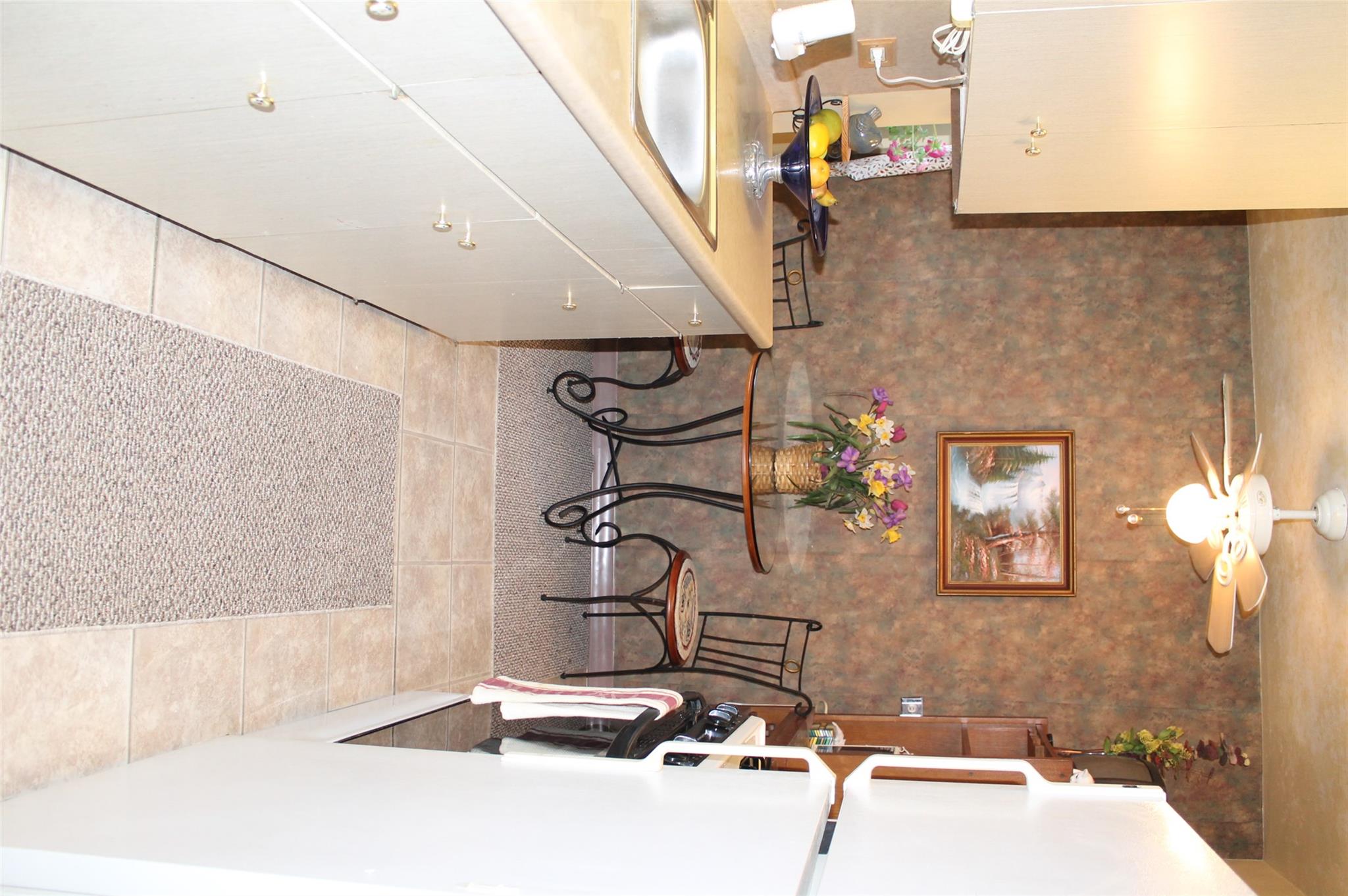 87-10 204th Street, Unit A62 Queens, NY 11423 - Photo 12 of 16 a view of a kitchen with breakfast area