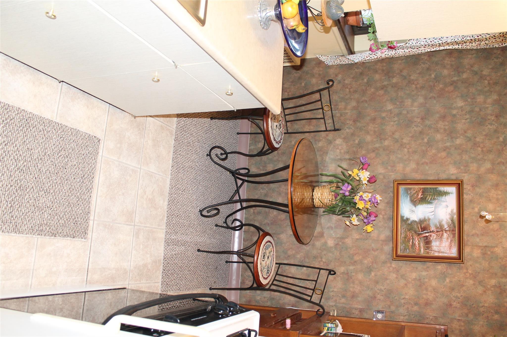 87-10 204th Street, Unit A62 Queens, NY 11423 - Photo 14 of 16 a view of a dining room with furniture
