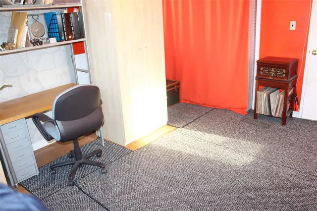 a workspace with furniture and rug