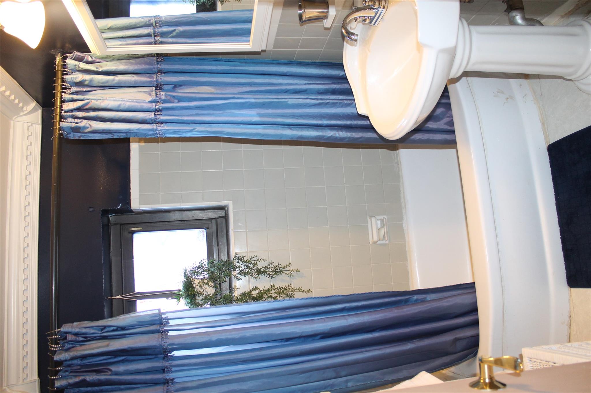 87-10 204th Street, Unit A62 Queens, NY 11423 - Photo 9 of 16 a bathroom with a sink and a toilet