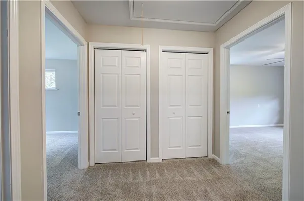 an empty room with closet area