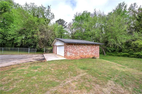a view of a backyard with a small cabin