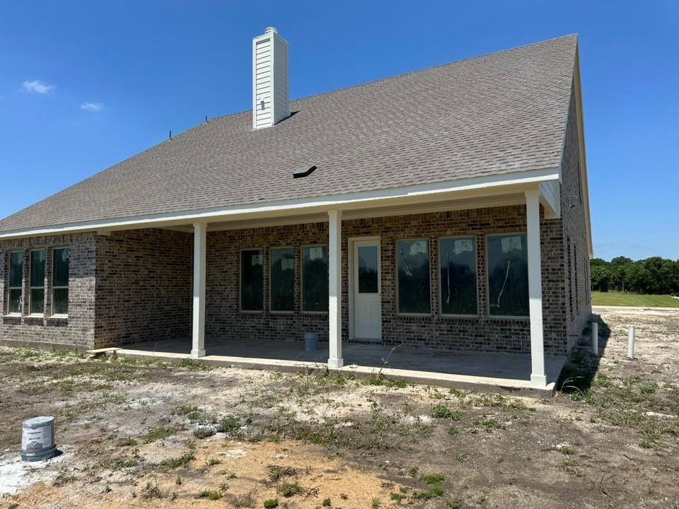 295 Brown Road Leonard, TX 75452 - Photo 23 of 26 Expansive covered patio featuring white support columns and a concrete surface