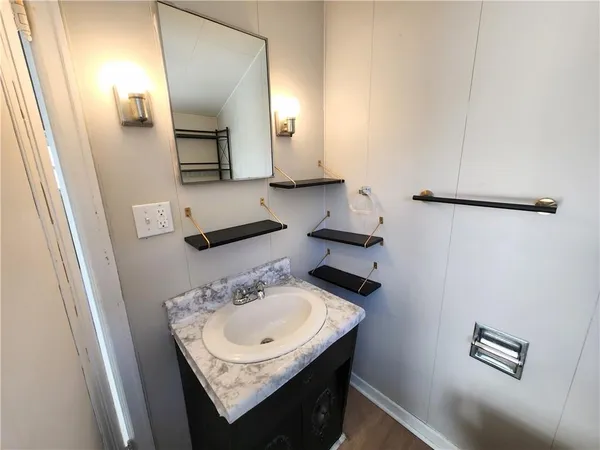 a bathroom with a sink and a mirror