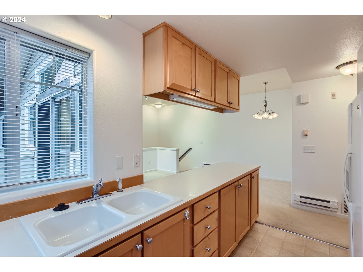 14740 Southwest Sandhill Loop, Unit 203 Beaverton, OR 97007 - Photo 17 of 35 a bathroom with a sink and a mirror