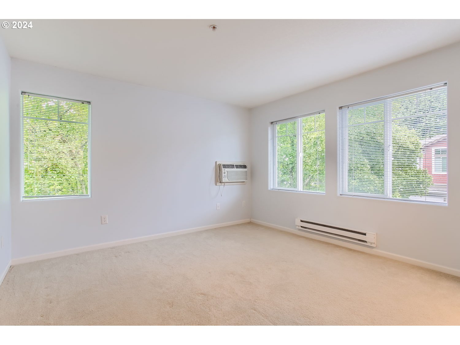 14740 Southwest Sandhill Loop, Unit 203 Beaverton, OR 97007 - Photo 22 of 35 a view of an empty room with a window