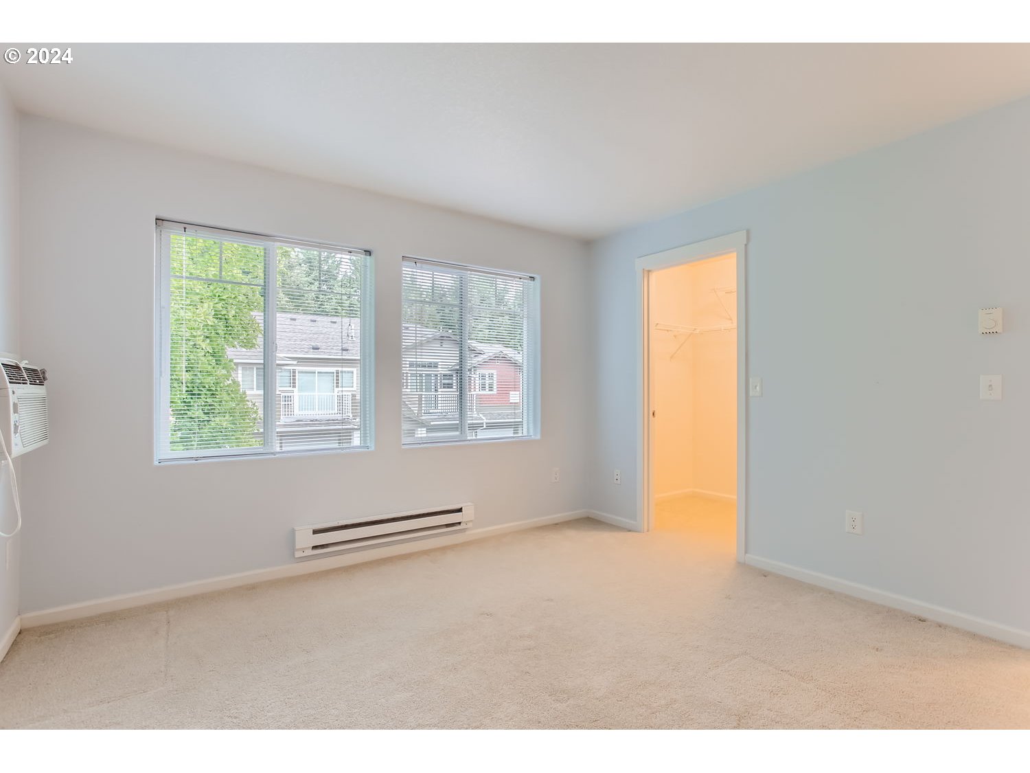 14740 Southwest Sandhill Loop, Unit 203 Beaverton, OR 97007 - Photo 23 of 35 an empty room with windows