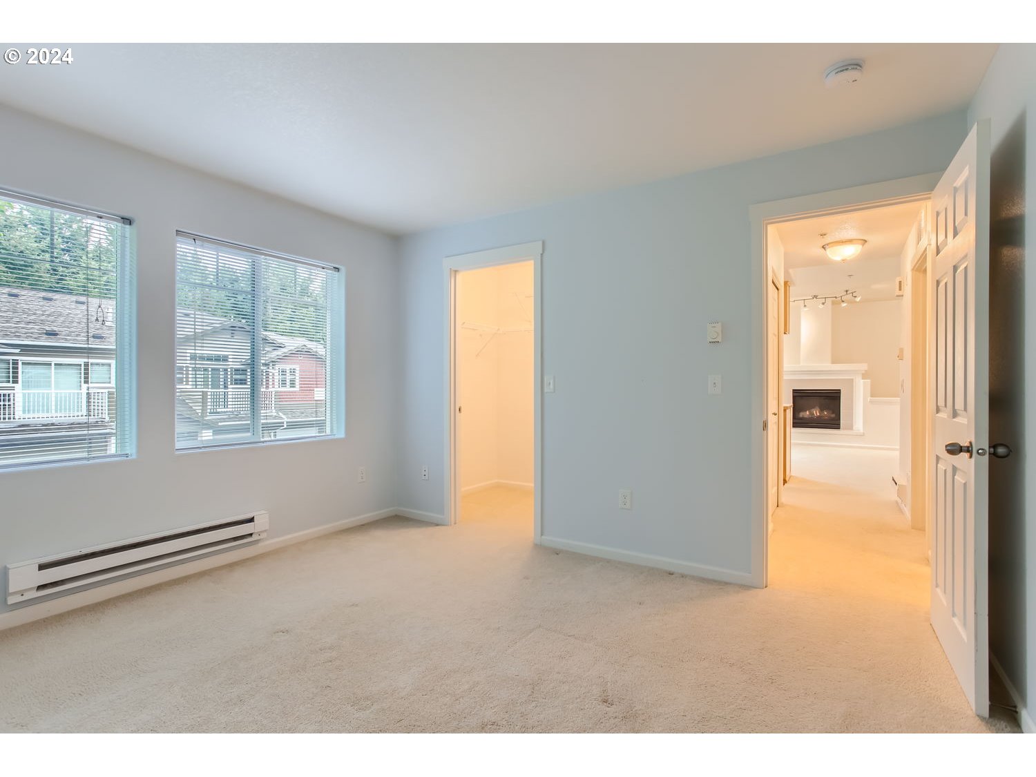 14740 Southwest Sandhill Loop, Unit 203 Beaverton, OR 97007 - Photo 24 of 35 a view of an empty room with a window