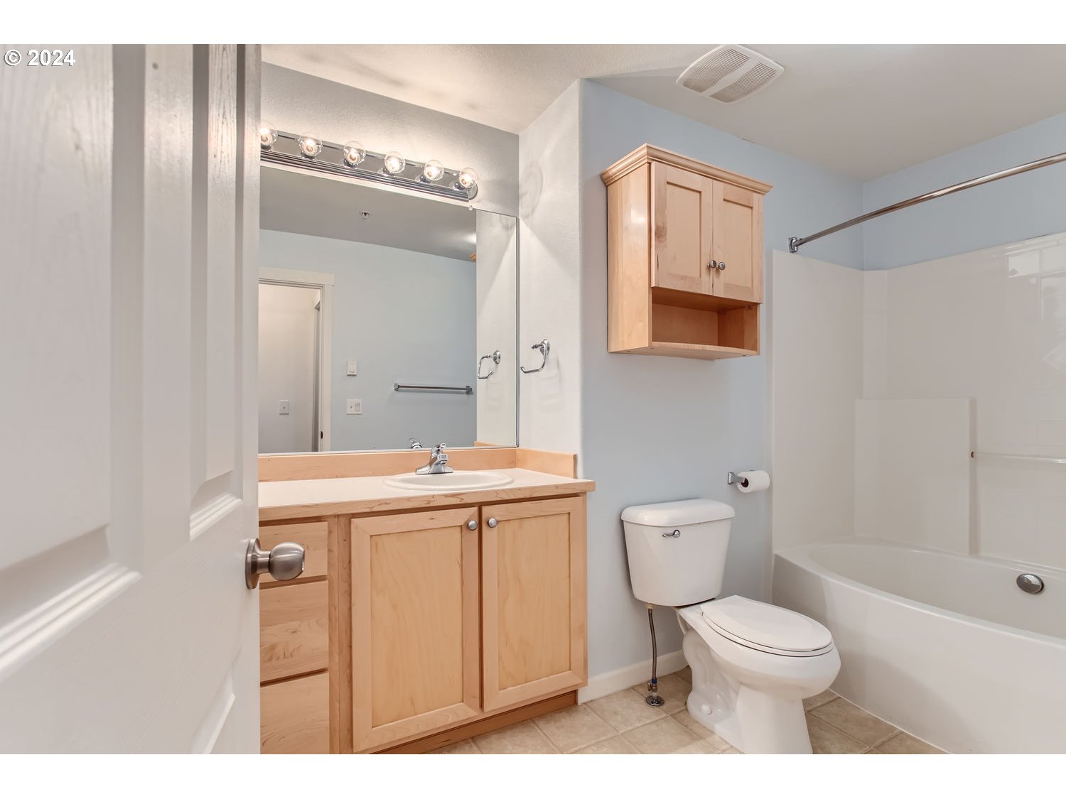 14740 Southwest Sandhill Loop, Unit 203 Beaverton, OR 97007 - Photo 26 of 35 a bathroom with a sink a toilet and shower