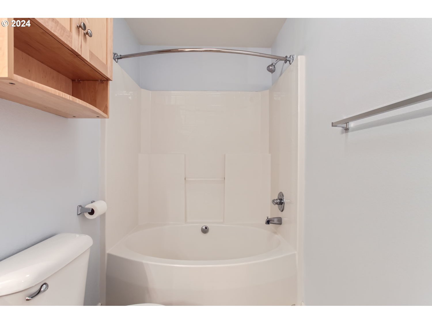 14740 Southwest Sandhill Loop, Unit 203 Beaverton, OR 97007 - Photo 27 of 35 a bathroom with a bathtub and a toilet