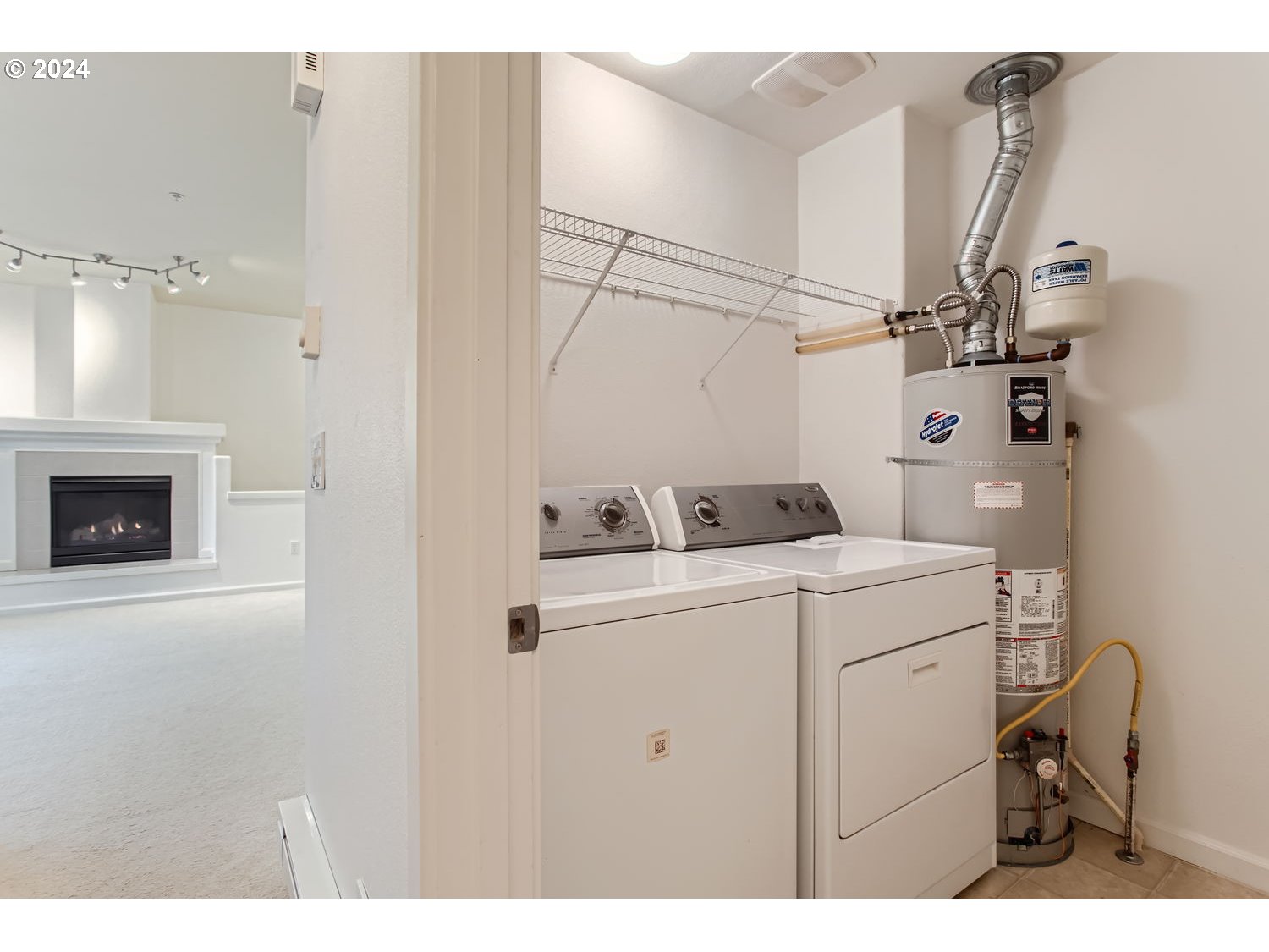 14740 Southwest Sandhill Loop, Unit 203 Beaverton, OR 97007 - Photo 29 of 35 a utility room with dryer and washer