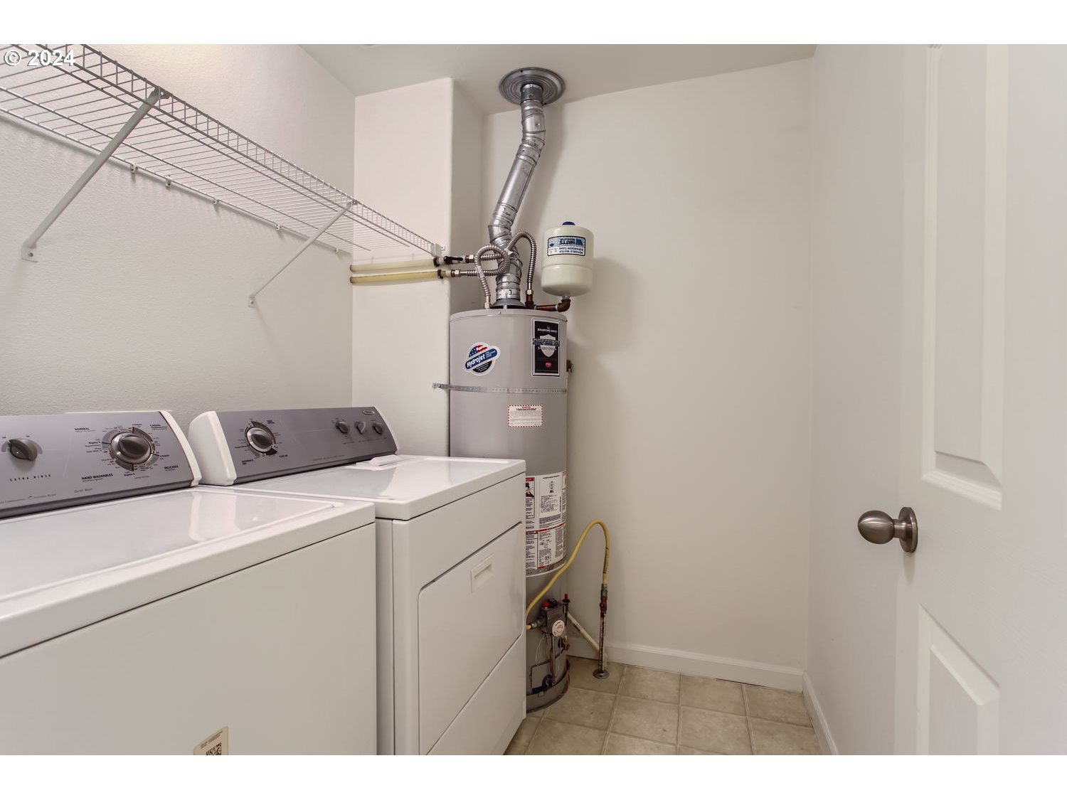 14740 Southwest Sandhill Loop, Unit 203 Beaverton, OR 97007 - Photo 30 of 35 a utility room with dryer and washer