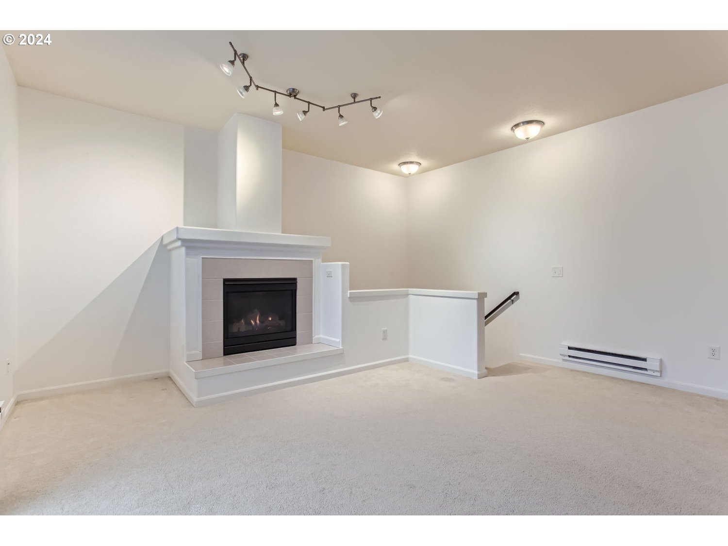 14740 Southwest Sandhill Loop, Unit 203 Beaverton, OR 97007 - Photo 6 of 35 a view of a livingroom with a fireplace