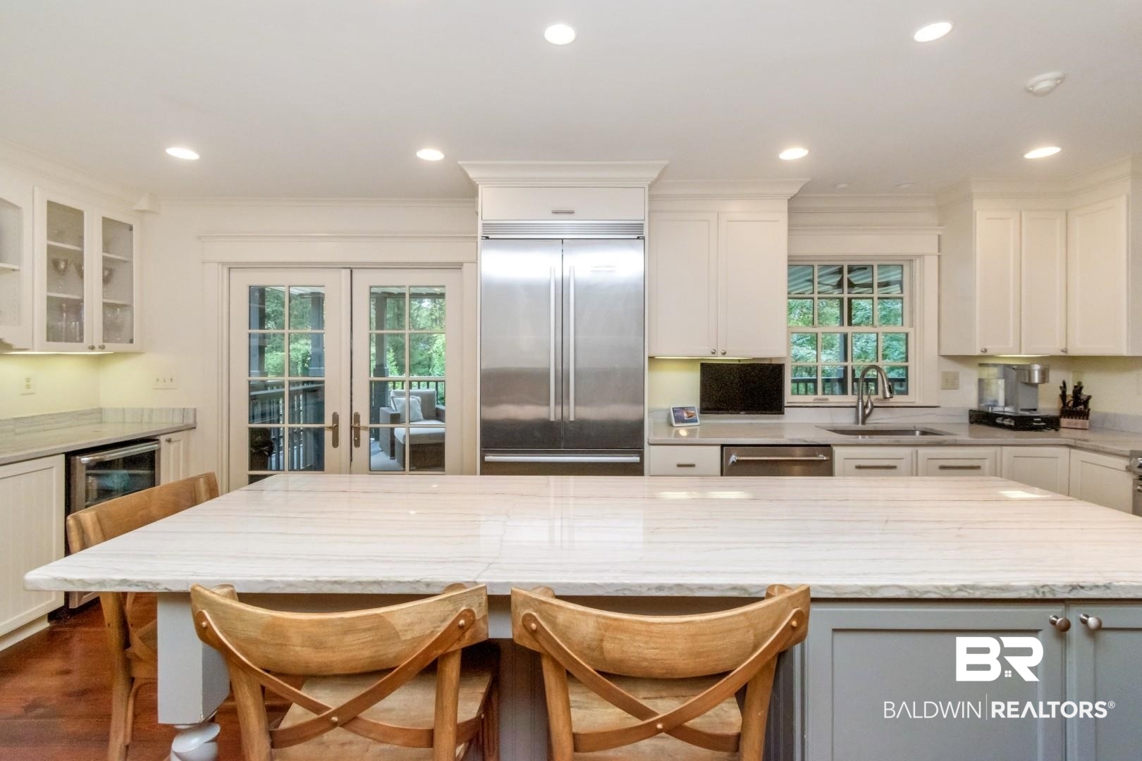 4810 Mums Court Mobile, AL 36608 - Photo 5 of 50 Kitchen with a breakfast bar, light stone counters, stainless steel appliances, white cabinets, and recessed lighting