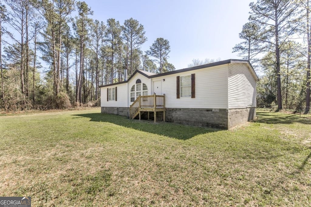 3331 Cummings Road Fort Valley, GA 31030 - Photo 1 of 1 a view of a house with a yard