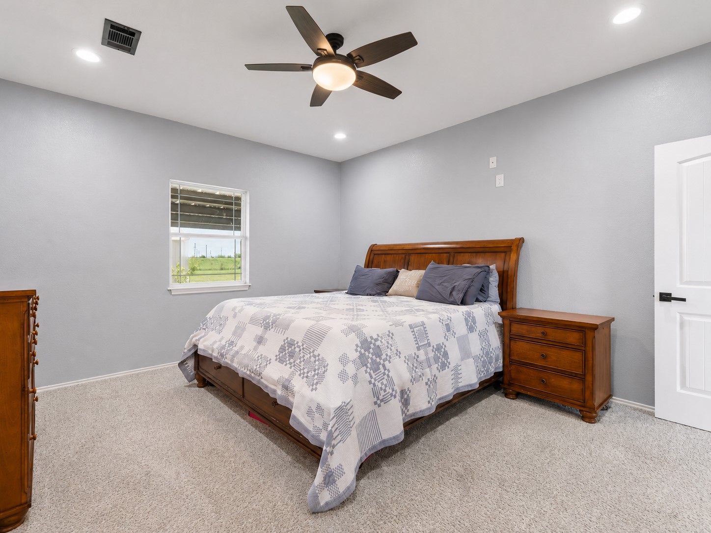 11301 South FM 441 Road El Campo, TX 77437 - Photo 10 of 32 The tranquil primary suite will be your escape at the end of a busy day.