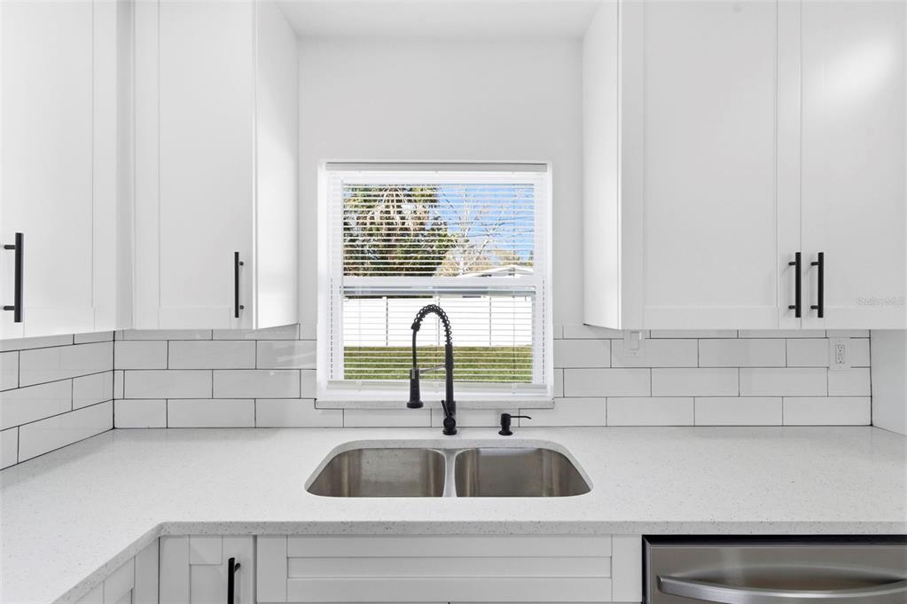 1448 South Belcher Road Largo, FL 33771 - Photo 12 of 47 a kitchen with a sink and cabinets