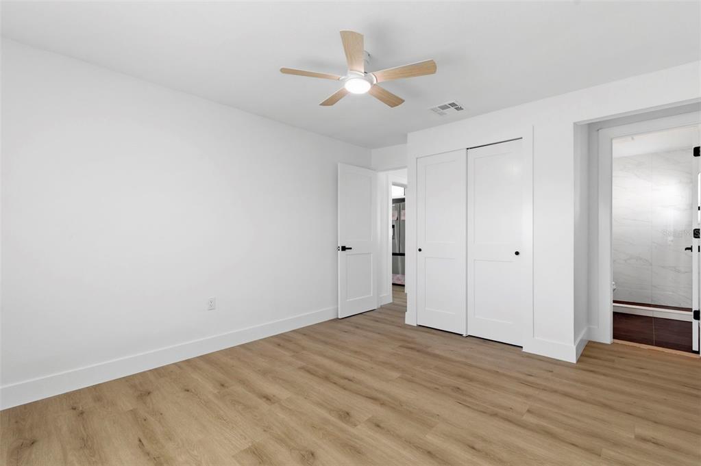 1448 South Belcher Road Largo, FL 33771 - Photo 21 of 47 wooden floor in an empty room
