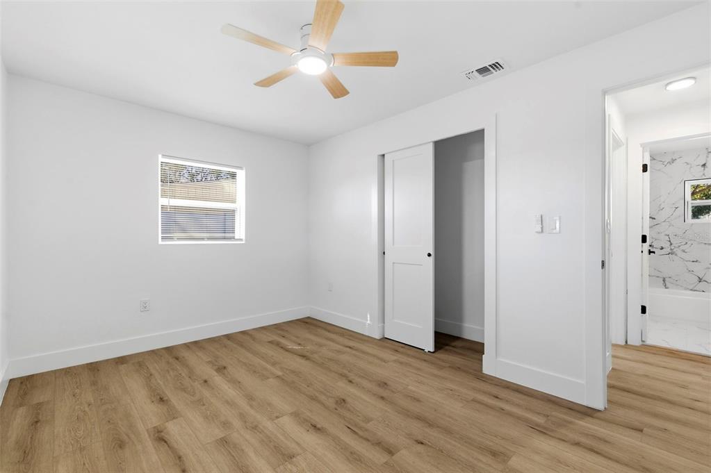 1448 South Belcher Road Largo, FL 33771 - Photo 26 of 47 wooden floor in an empty room with a window