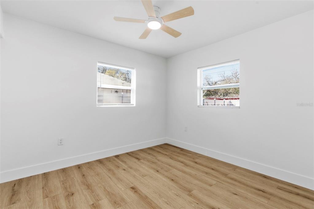1448 South Belcher Road Largo, FL 33771 - Photo 28 of 47 wooden floor in an empty room with a window